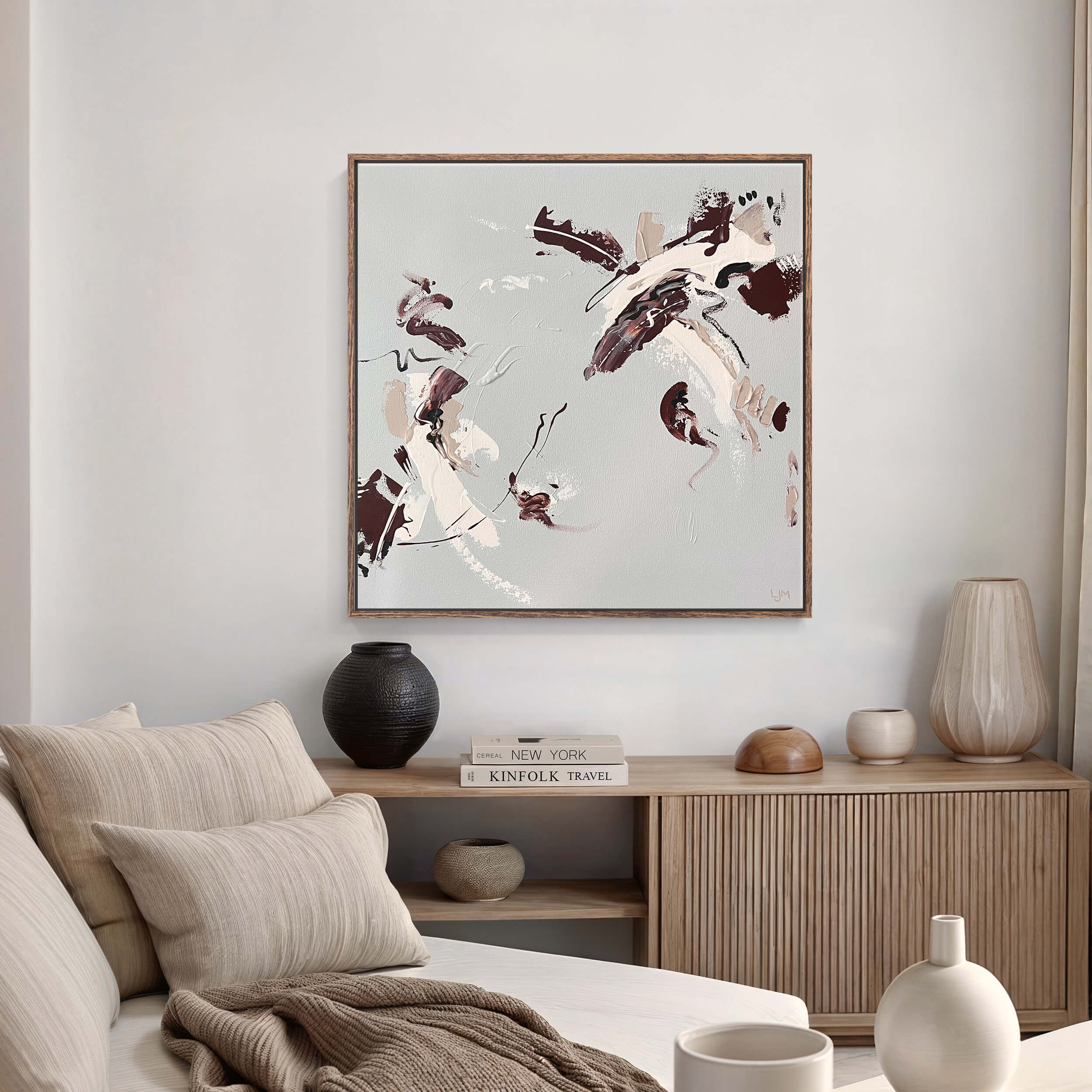 A medium natural abstract painting by Lee J Morgan Art displayed on a living room wall