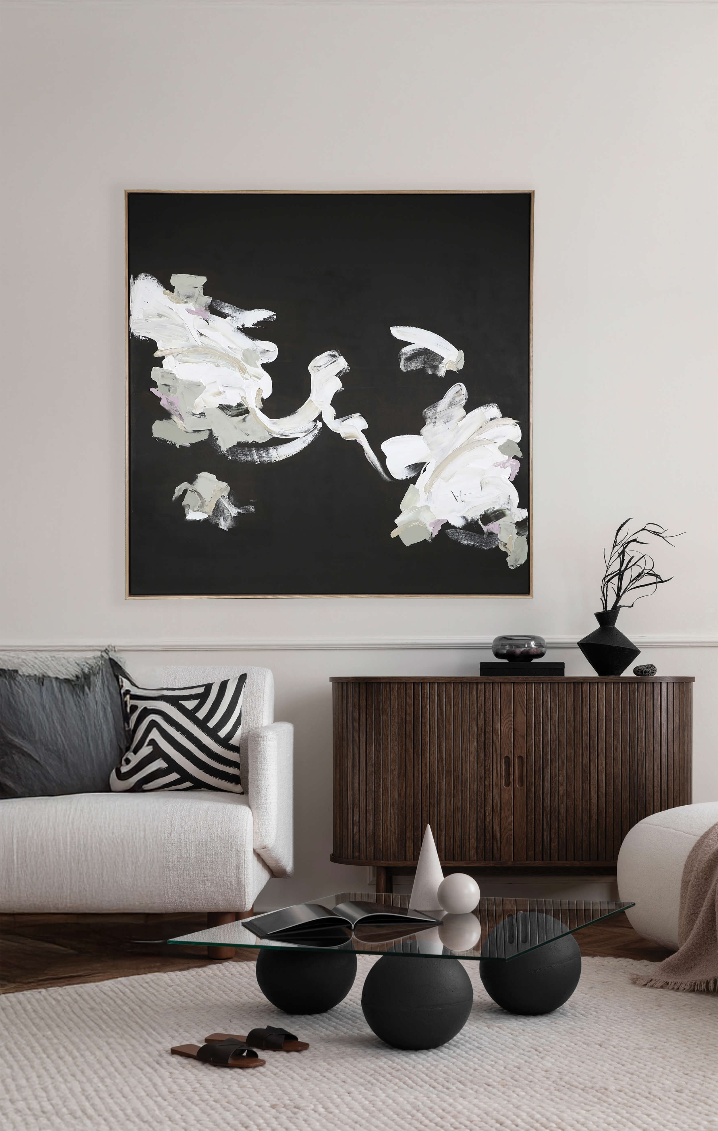 A large dark abstract artwork by Lee J Morgan displayed on a living room wall.