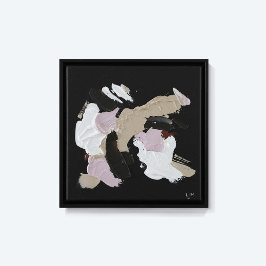 A small, dark abstract painting by Lee J Morgan displayed on a living room wall