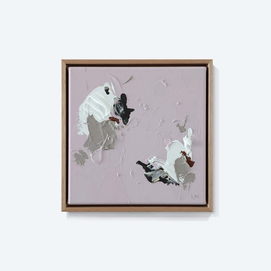 A small pink abstract painting by Lee J Morgan Art displayed on a living room wall