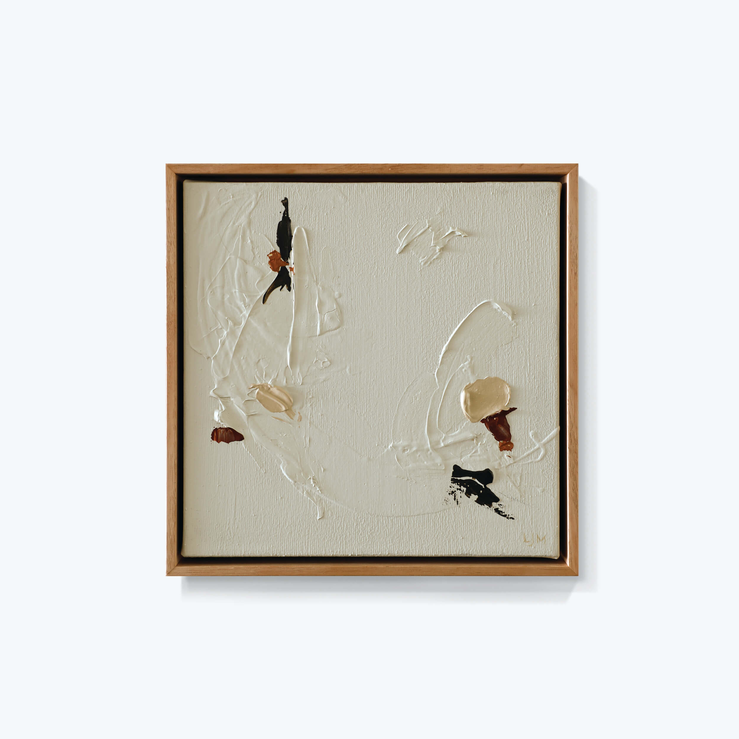 A small neutral abstract painting by Lee J Morgan Art displayed on a living room wall