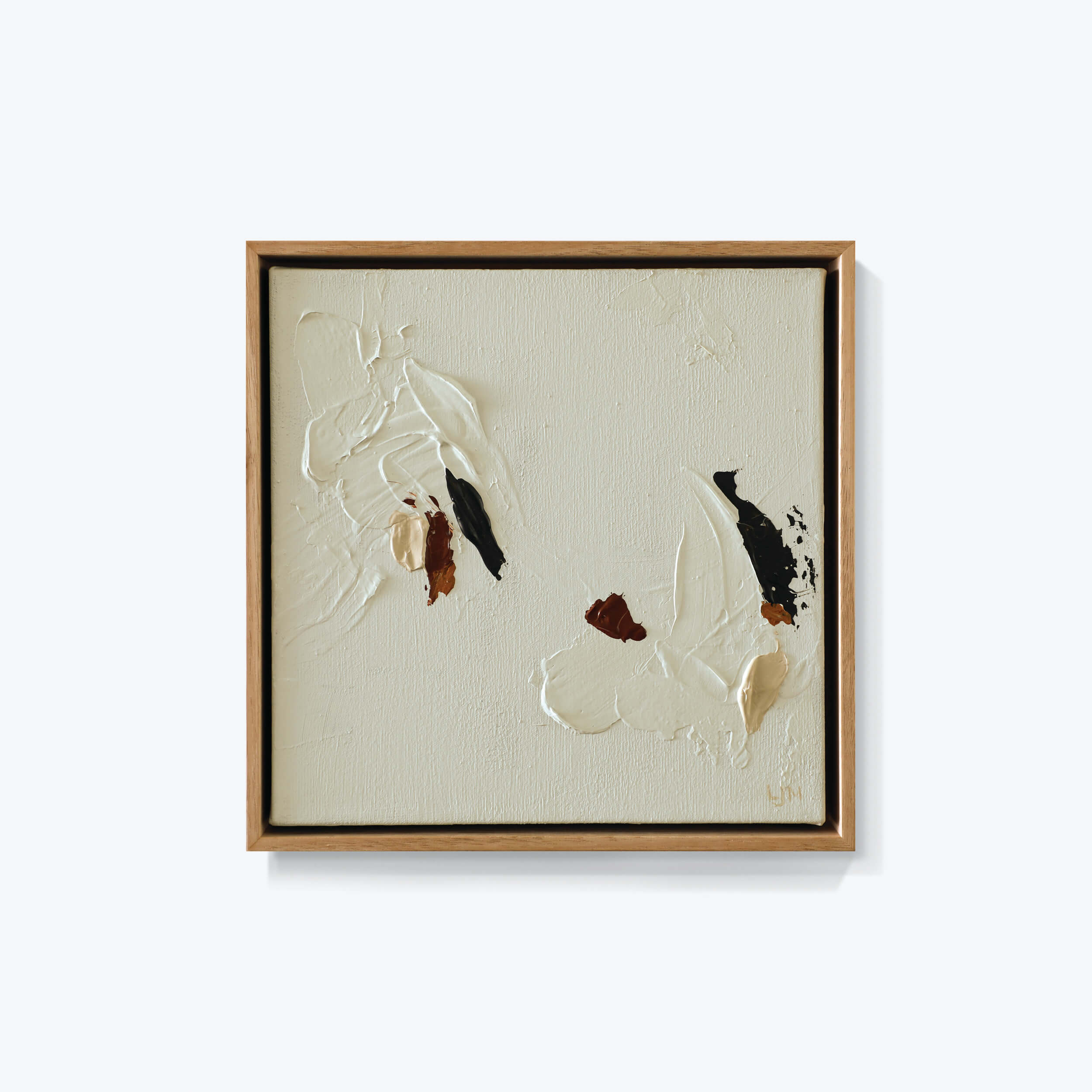 A small neutral abstract painting by Lee J Morgan Art displayed on a living room wall