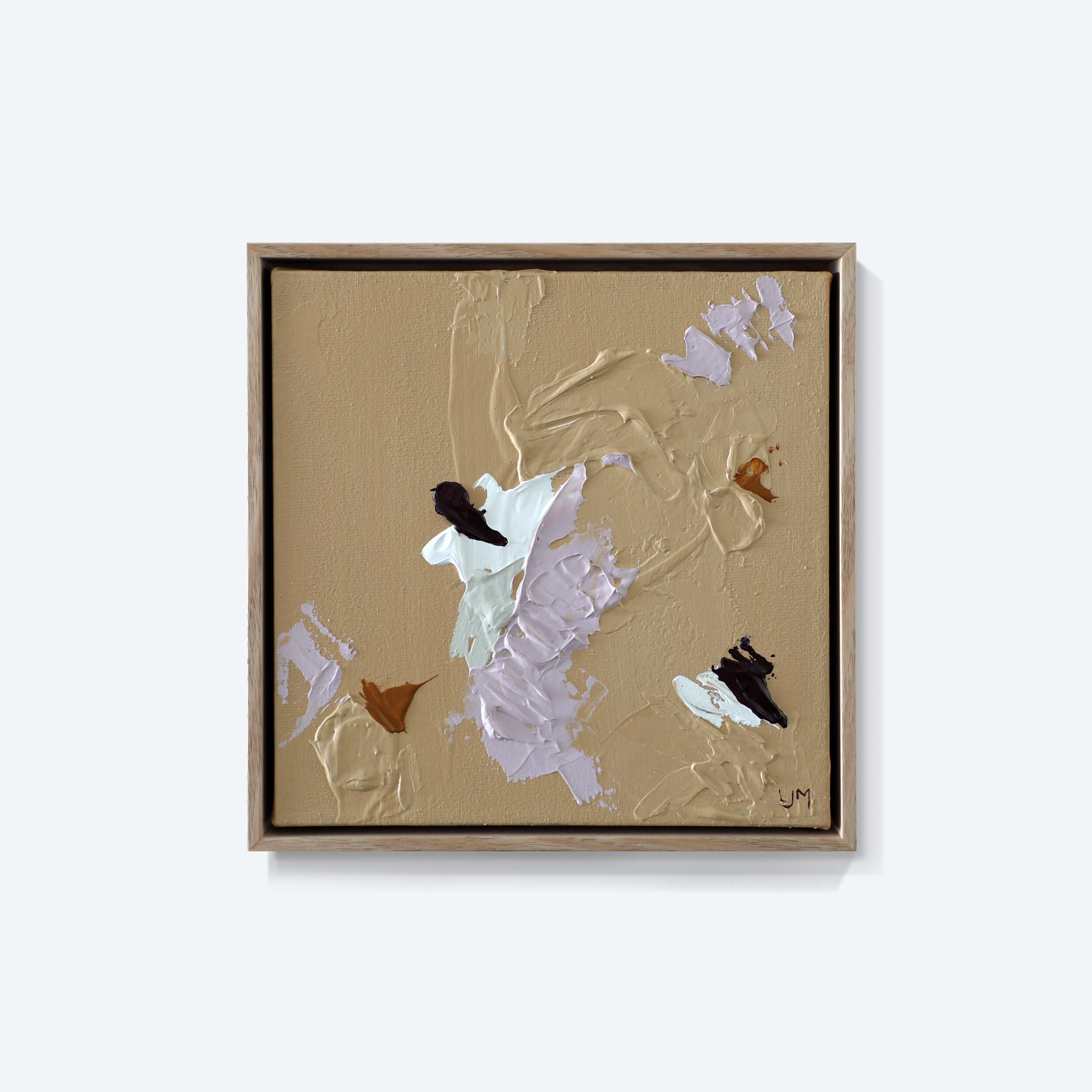 A small, neutral abstract painting by Lee J Morgan displayed on a living room wall