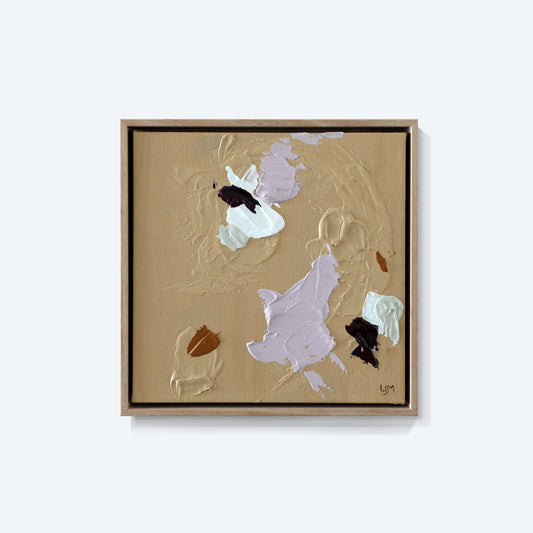 A small, neutral abstract painting by Lee J Morgan displayed on a living room wall