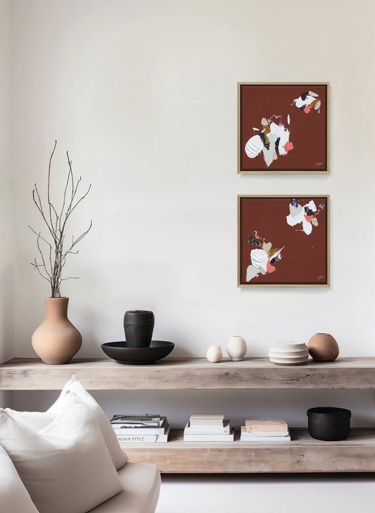 A small, red abstract painting by Lee J Morgan displayed on a living room wall