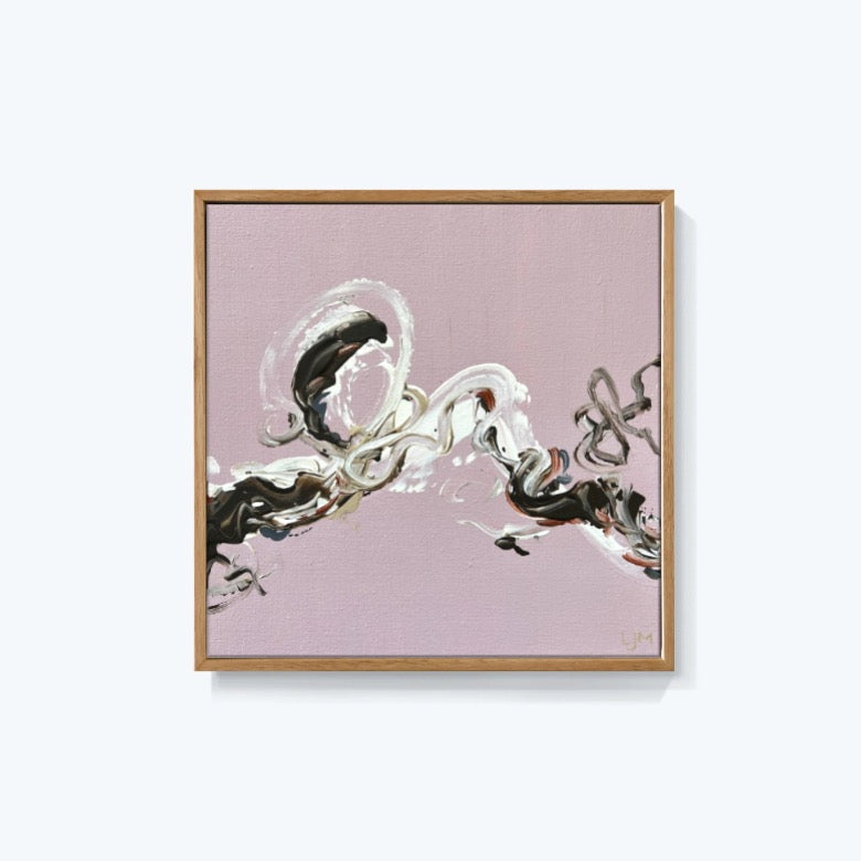 A small pink abstract art by Lee J Morgan displayed on a living room wall