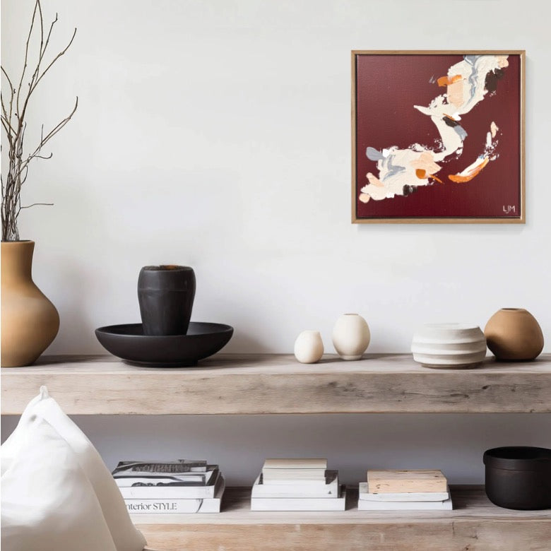 A small brown artwork by Lee J Morgan Art displayed on a living room wall