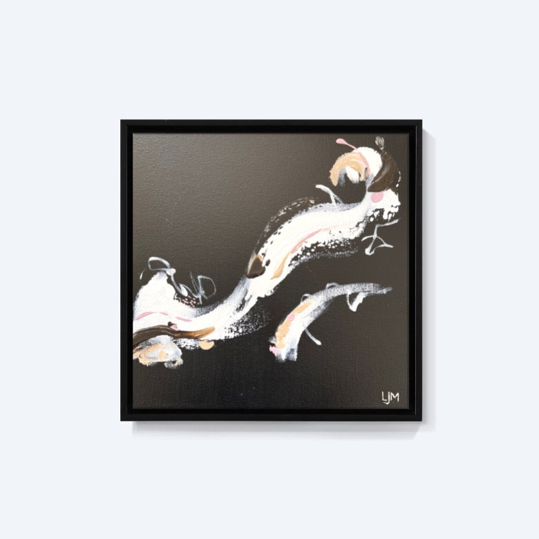 A small black artwork by Lee J Morgan Art displayed on a living room wall