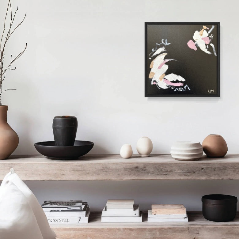 A small black artwork by Lee J Morgan Art displayed on a living room wall