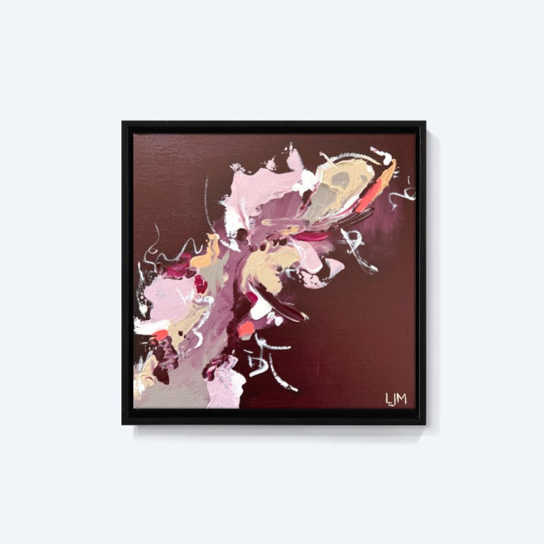 A small burgundy artwork by Lee J Morgan Art displayed on a living room wall